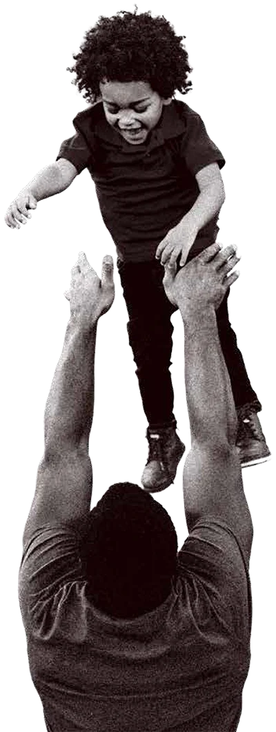 Father lifting child outdoors